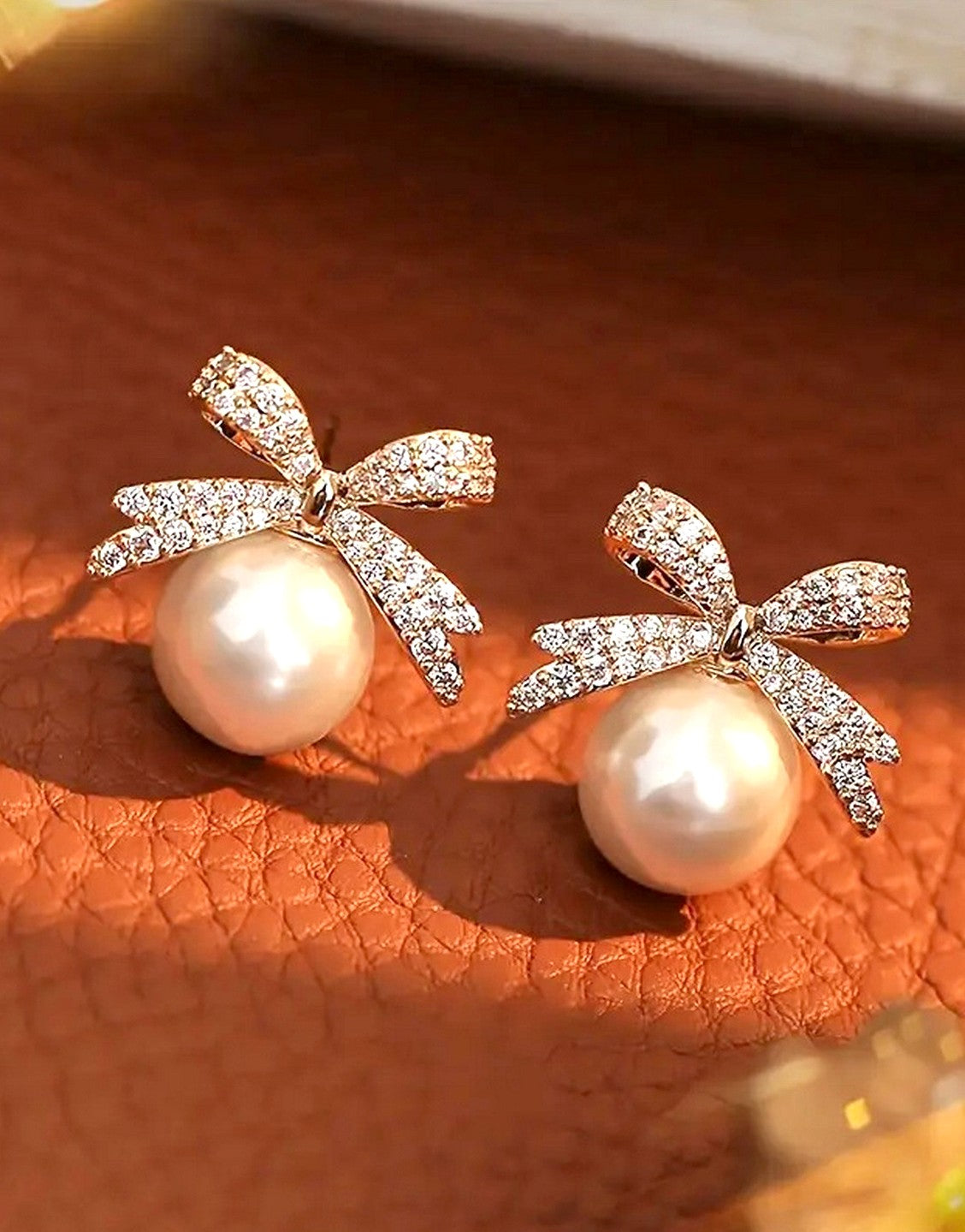 Dazzling Rhinestones Bow Shape Faux Pearls Stud Earrings (TK18131)